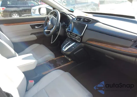 2021 Honda Cr-V Hybrid Touring z USA, uszkodzony, nr VIN 7FART6H93ME038094